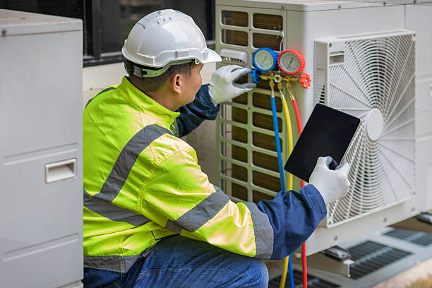 Professional Air Conditioning Repair technician working in Hartland, MI
